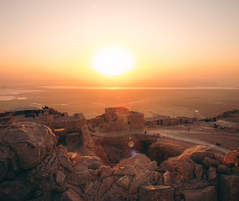 brown rock formation during sunset