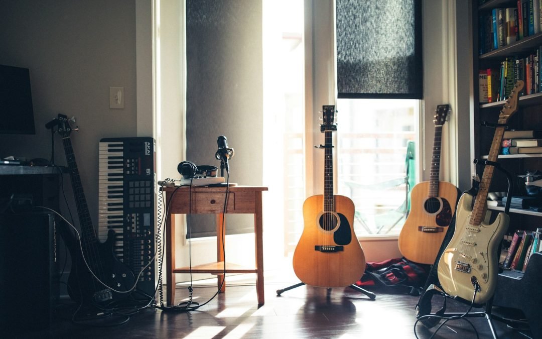 several guitars beside of side table