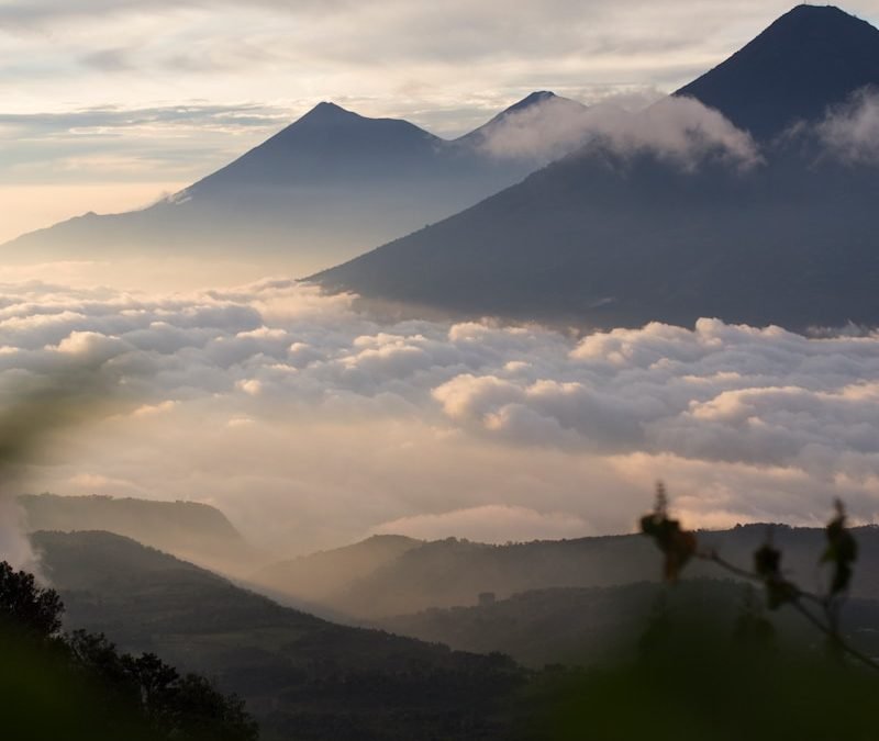 mountains under cloudy sky during daytime